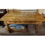 A 1.4m old pine farmhouse kitchen table with two frieze drawers, set on turned legs - age related