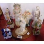 A selection of ceramic figurines including small Royal Doulton Top O' The Hill HN3499, etc. -