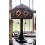 A modern Tiffany style lamp with bronzed effect base and glass shade