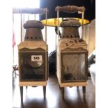 A pair of old carriage style lanterns with turned wooden handles - converted for electricity - a/f