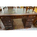 A 1.2m 20th Century stained mixed wood twin pedestal desk with green leather inset top and three