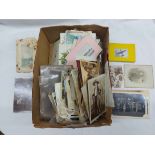 A collection of late Victorian and later family photographs, cartes de visite, greeting cards and