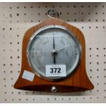 A small bell shaped oak framed Shortland Bros aneroid wall barometer