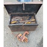 An old metal toolbox containing a small quantity of tools - sold with a bench vice