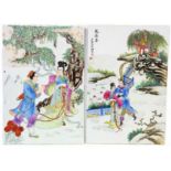 A pair of 20th Century Chinese porcelain panels, each depicting a pair of lovers in a landscape with