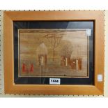 A framed African collage picture formed from bark and natural materials, depicting figures around