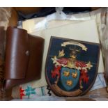 A box containing a quantity of assorted collectable items including armourial shield, etc.