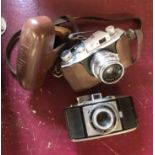 A vintage Halina camera in leather case - sold with a similar Agfa Karat camera