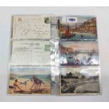 A small collection of plastic sleeved vintage postcards - mostly Torquay examples