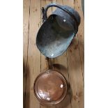 A copper coal scuttle of helmet form - sold with a copper bed warming pan