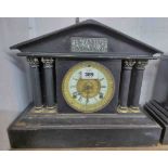 A late Victorian black painted metal mantel clock of architectural design with Ansonia gong striking