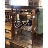 An Edwardian mahogany occasional table with spindle decoration and slatted undertier