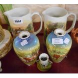 A pair of old milk jugs with coloured transfer printed scenes of farmyard life - sold with a pair of