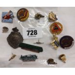 A bag containing a quantity of enamel badges including 1949 Filey Butlins, etc.