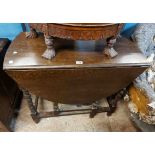 An 88cm early 20th Century stained oak gateleg table, set on barley twist supports