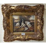 A reproduction ornate gilt framed varnished coloured print, depicting three dogs beneath a tree