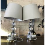 A pair of modern Laura Ashley table lamps with clear glass ball decoration and chrome plated