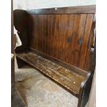 A 1.76m old elm and stained pine wing back tavern settle with solid elm seat and sides