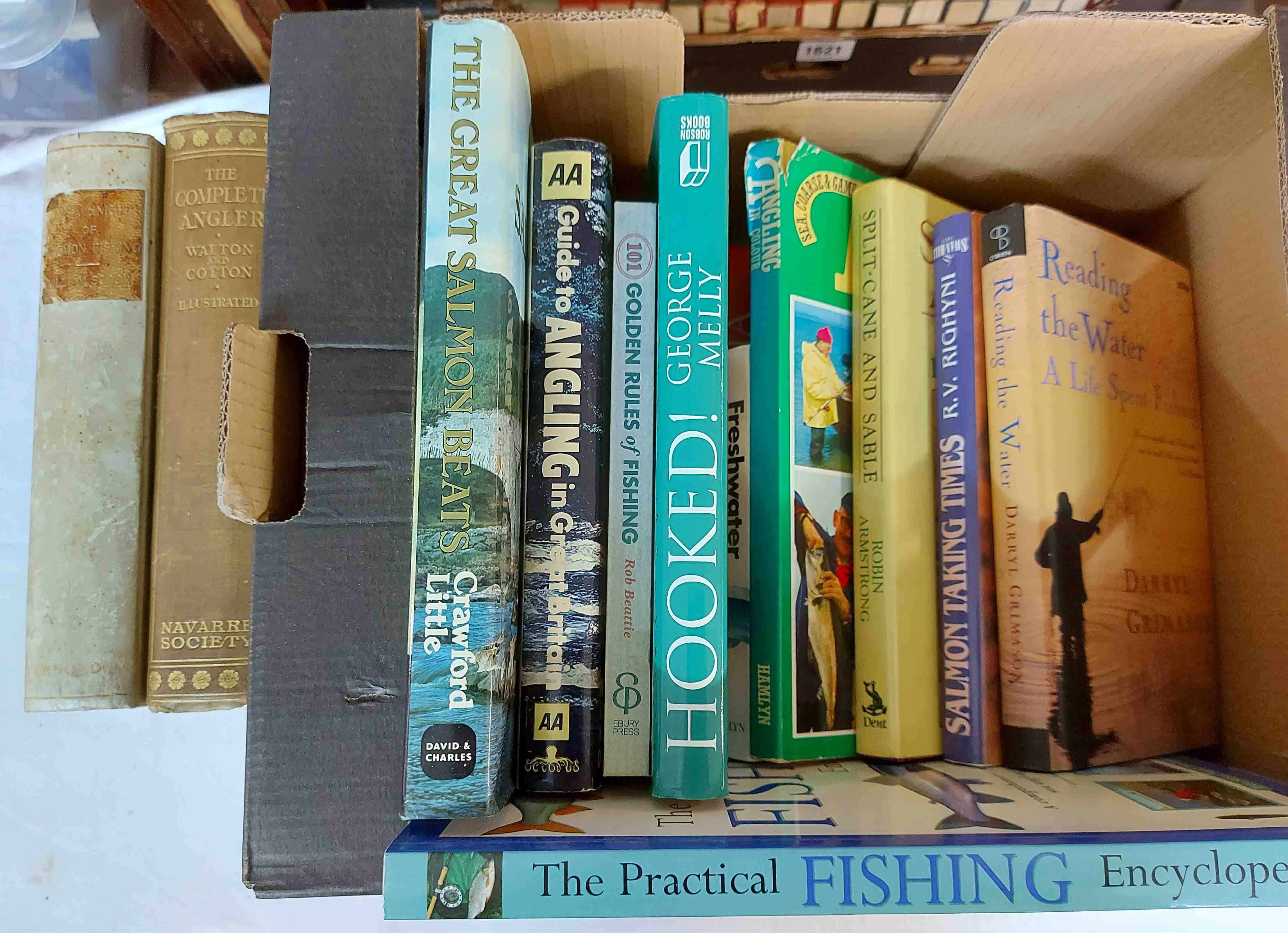 A box containing a collection of fishing related books including The Complete Angler: by Walton &