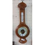 A 20th Century small oak mounted banjo barometer/thermometer with visible aneroid works to dial