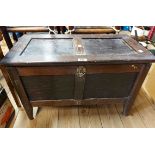 A 67cm antique stained oak two panel lift-top chest with adapted interior, set on tapered legs