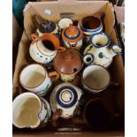 A box containing a quantity of Torquay mottoware including teapots, vases, mugs, etc. - various