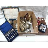 A box containing a quantity of silver plated items including cutlery and gravy boat, etc.