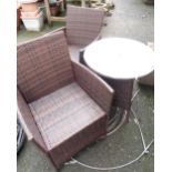 A Chelsea Garden Furniture woven plastic garden table with glass top and a pair of elbow chairs to