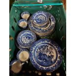 A box containing a quantity of Burleigh Ware willow pattern teaware including cups and saucers,