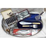 A silver plated oval gallery tray containing cased fish servers, silver collared scent bottle, etc,