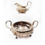 A William IV Irish silver large two handled sugar bowl with decorative cast rim and embossed