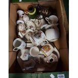 A box containing a quantity of assorted ceramic items including commemorative ware, dressing table