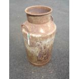 A vintage metal milk churn with flanking handles - lid missing