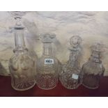 Four 19th Century glass decanters and stoppers