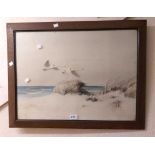 A framed coloured print, depicting swans in flight over sand dunes