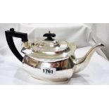 A silver teapot of bulbous oblong form with bakelite handle and knop - Chester 1939