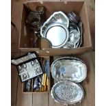 A box containing a quantity of silver plated items including trays, baskets, wine cooler and caster,