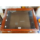 A 58cm modern stained wood tabletop display case with brown baise lined interior enclosed by a