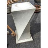 A 60cm high modern cast concrete sundial pedestal of spiral form