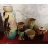 Six pieces of Torquay pottery, each decorated in the Sailing Boats pattern including vases,