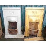 A pair of painted cast iron bedroom fireplace inserts with Arts & Crafts decoration - both complete
