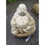 A 28cm cast concrete statue of a seated Buddha