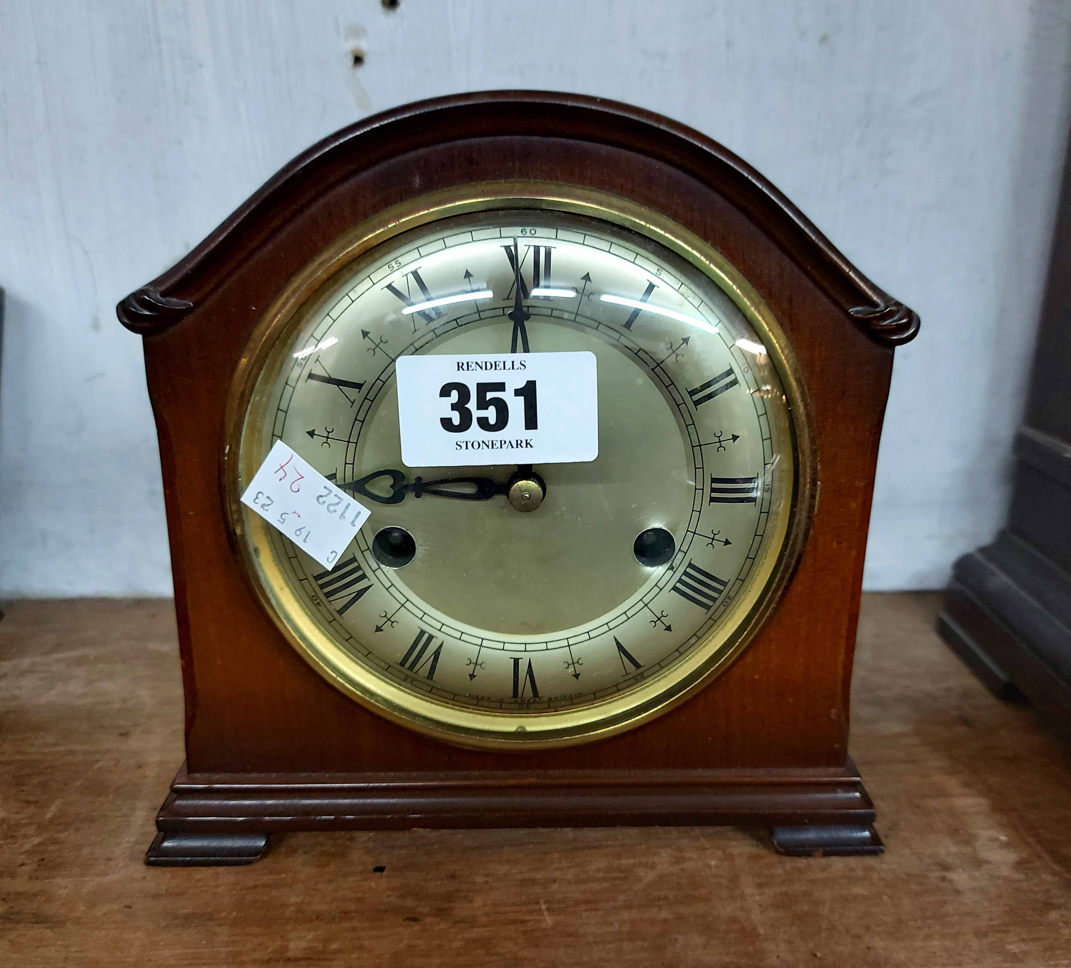 A vintage Smiths polished walnut cased mantel clock with eight day gong striking movement
