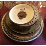 A quantity of Torquay pottery plates and plaques of various size and form including commemorative,