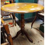 A Theodore Alexander reproduction mahogany wine table, set on turned pillar with triple cabriole