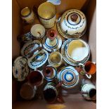 A box containing a quantity of Torquay mottoware of various form including candlesticks, jugs,