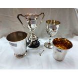 Four silver plated items comprising trophy cup, goblet, tankard and parcel gilt vessel - all