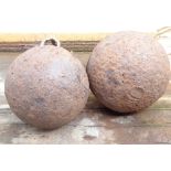 Two large antique cannon balls