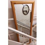 A modern pine framed narrow oblong wall mirror