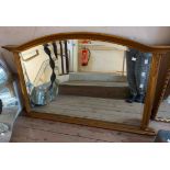 A reproduction gilt framed overmantel mirror with break arch top and bevelled plate